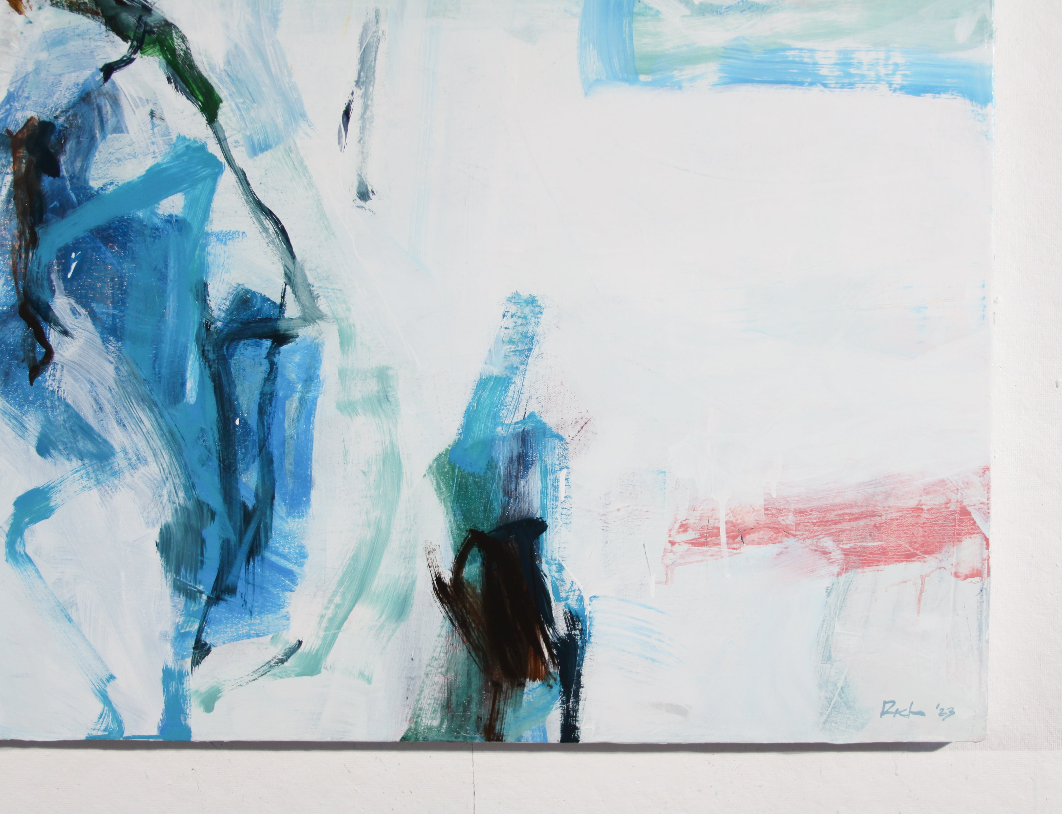 An abstract painting featuring expressive brushstrokes in shades of blue, teal, white, and a soft pink accent, with a small artist signature in the bottom right corner.