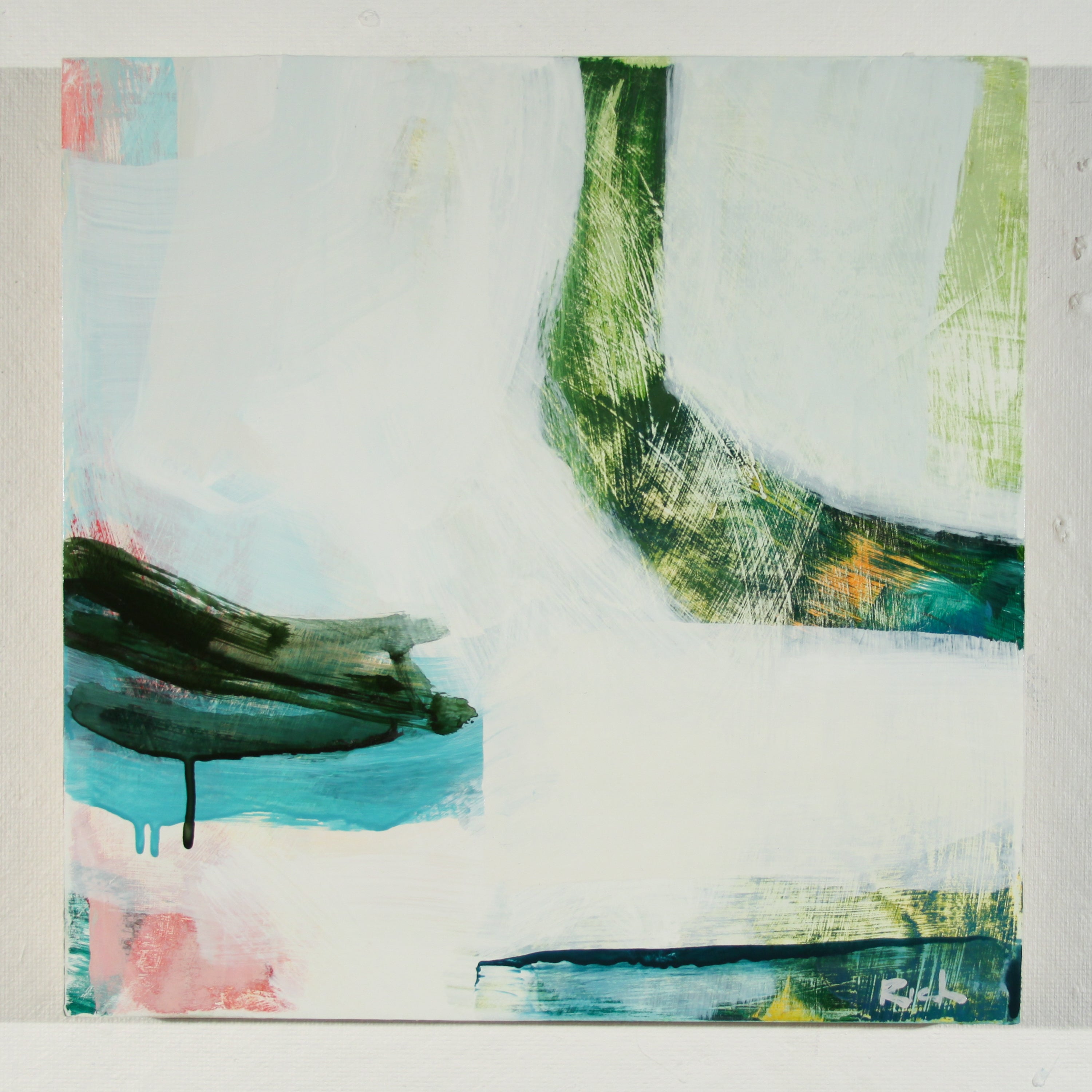 An abstract painting on a square canvas featuring textured brushstrokes of green, teal, pink, and blue on a predominantly white background, with a visible artist signature in the bottom right corner.