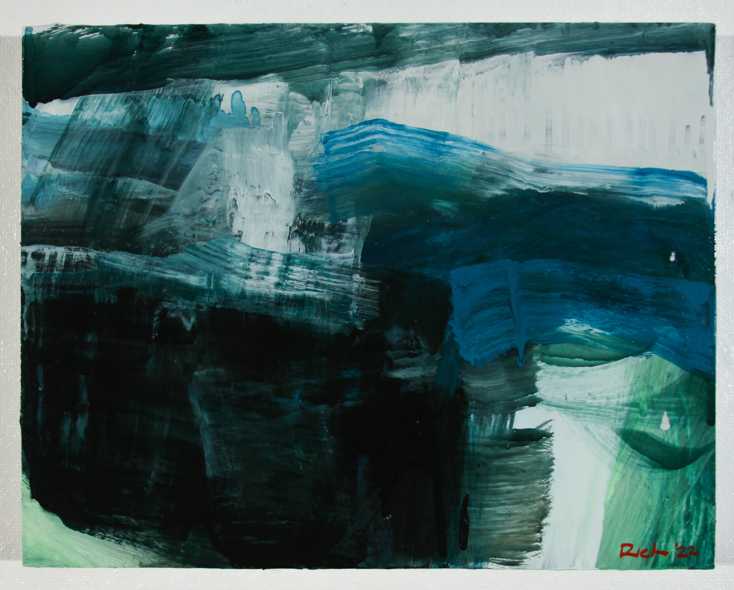 An abstract painting with expressive, layered brushstrokes in deep black, teal, blue, white, and light green, with a small red artist signature in the bottom right corner.
