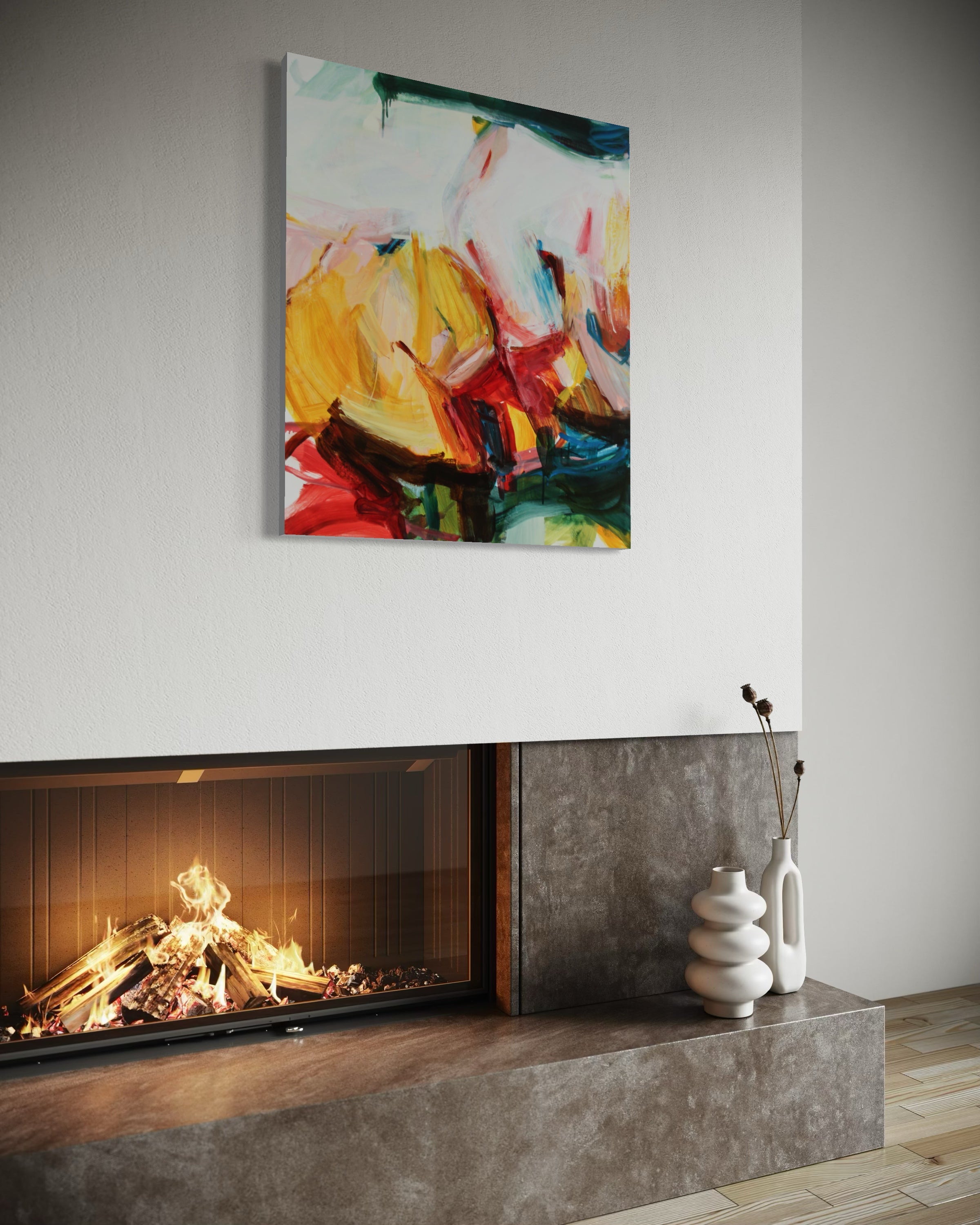 An abstract canvas wall art print with vibrant yellow, red, blue, and white brushstrokes, displayed in a modern living room setting above a fireplace.
