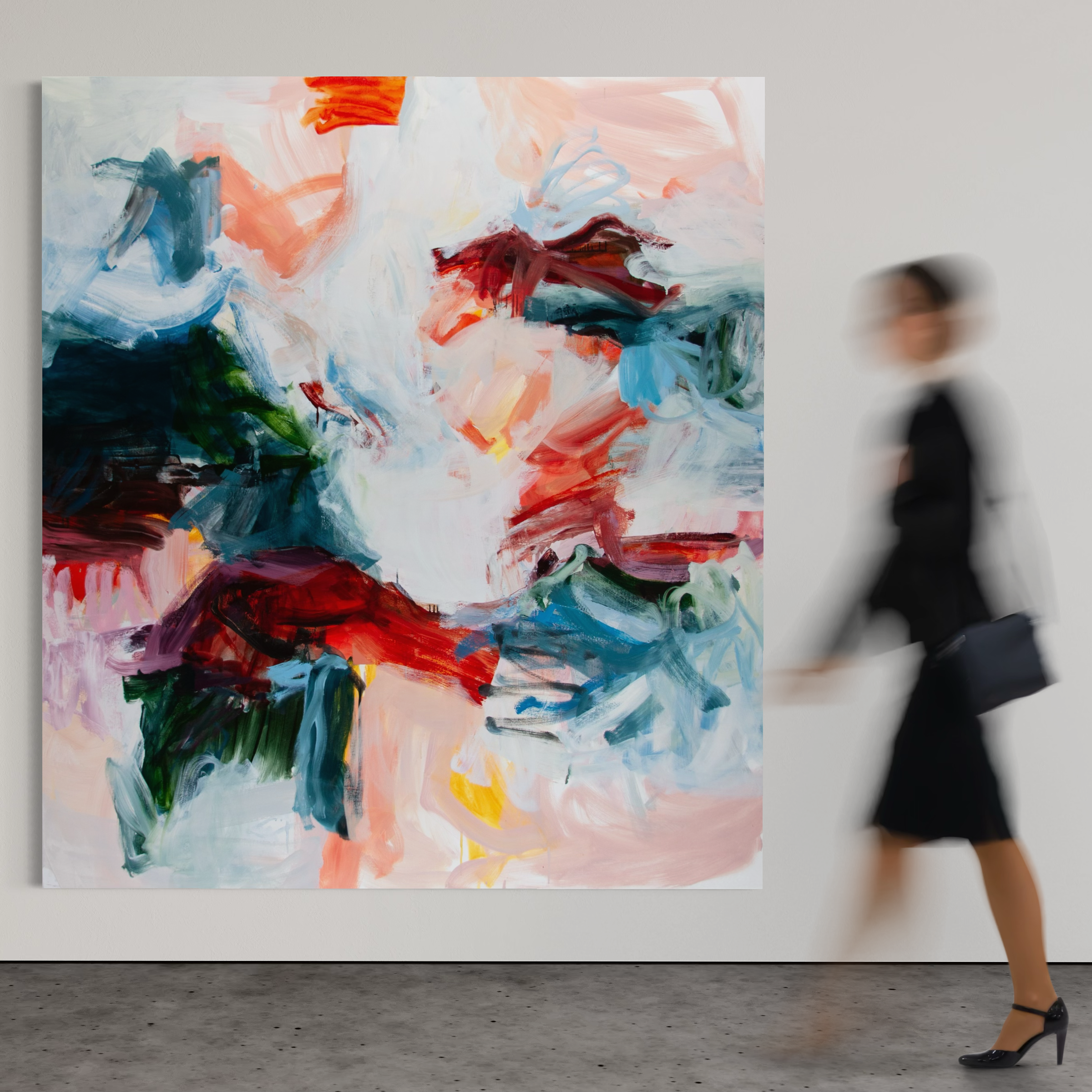 An abstract canvas painting with expressive brushstrokes in white, red, blue, green, and peach tones hangs on a light gray gallery wall. A blurred woman in a black dress and heels walks past the artwork on the right.