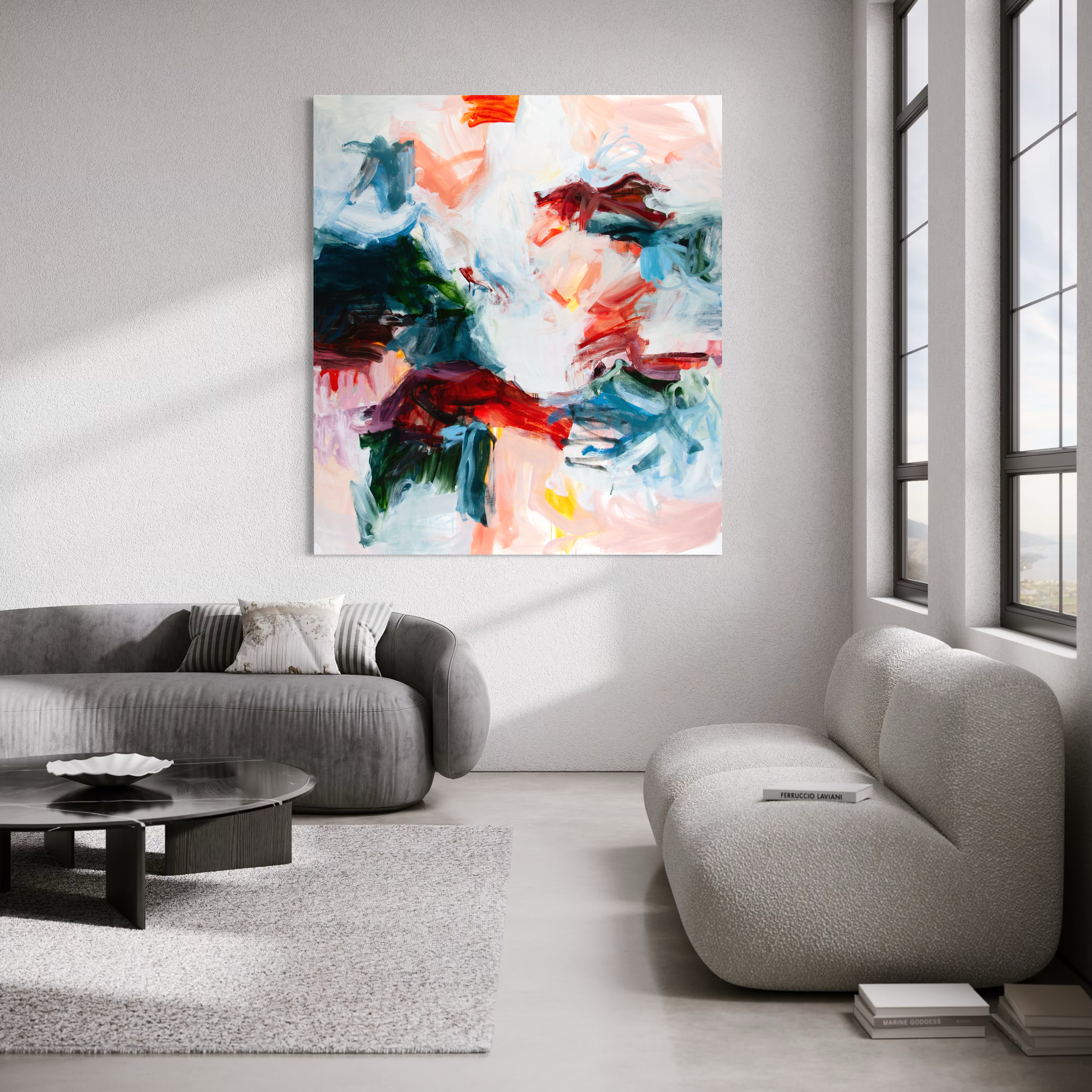 An abstract canvas wall art print with vibrant brushstrokes of red, blue, green, pink, and white, displayed in a modern living room setting above a gray sofa.